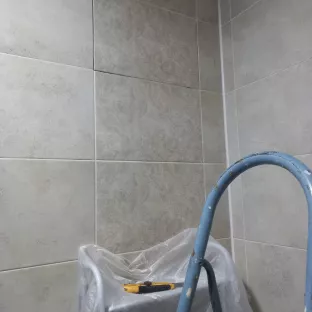 Вырезать плитку и зделать люк дверце